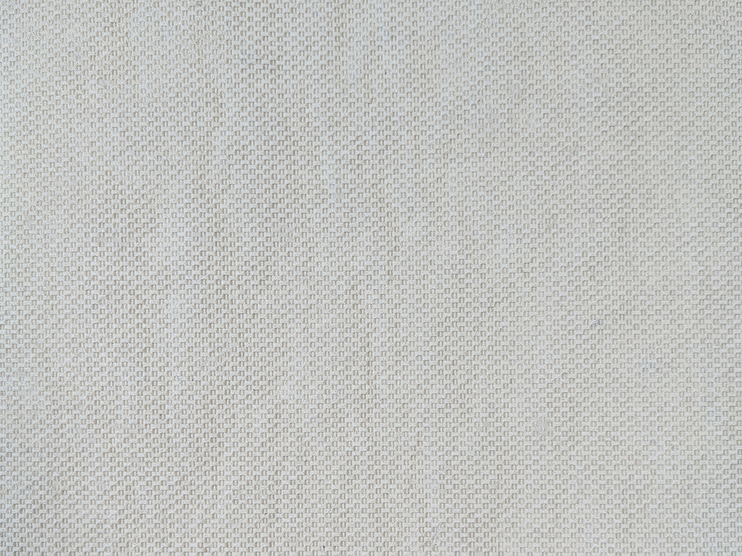 Tan basketweave non-skid backing of the low-profile all-surface rug pad