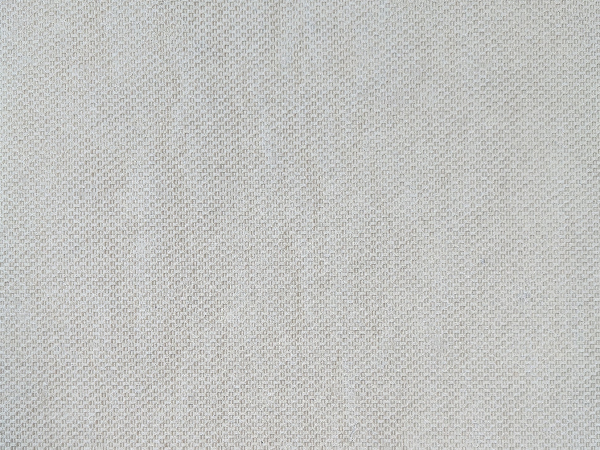 Tan basketweave non-skid backing of the low-profile all-surface rug pad