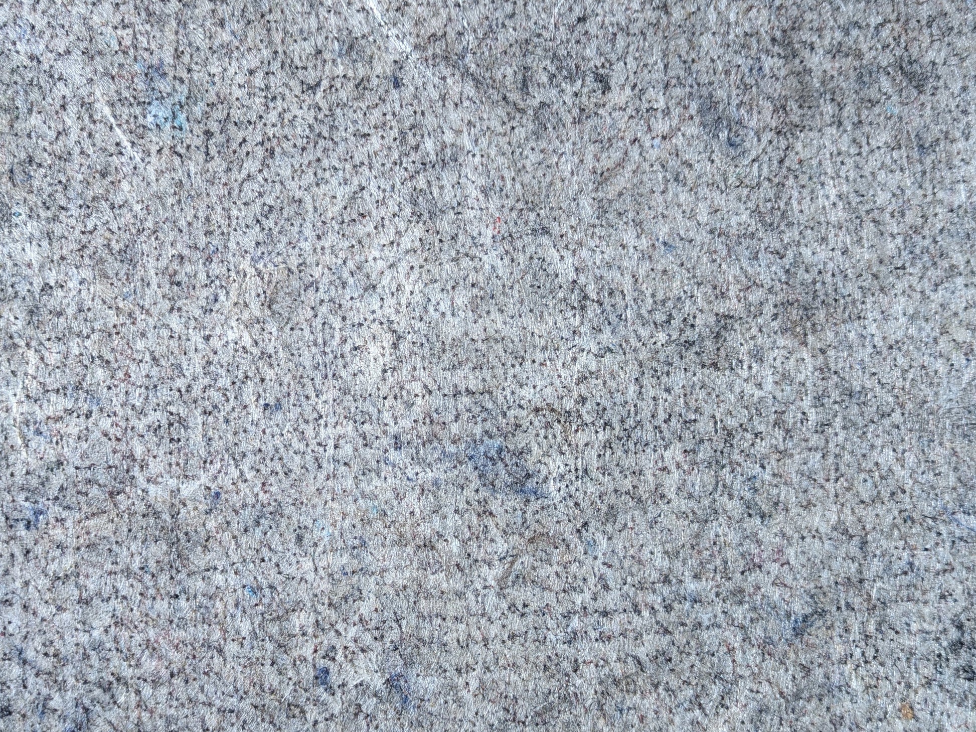 Recycled fiber surface of the designer cushioned rug pad