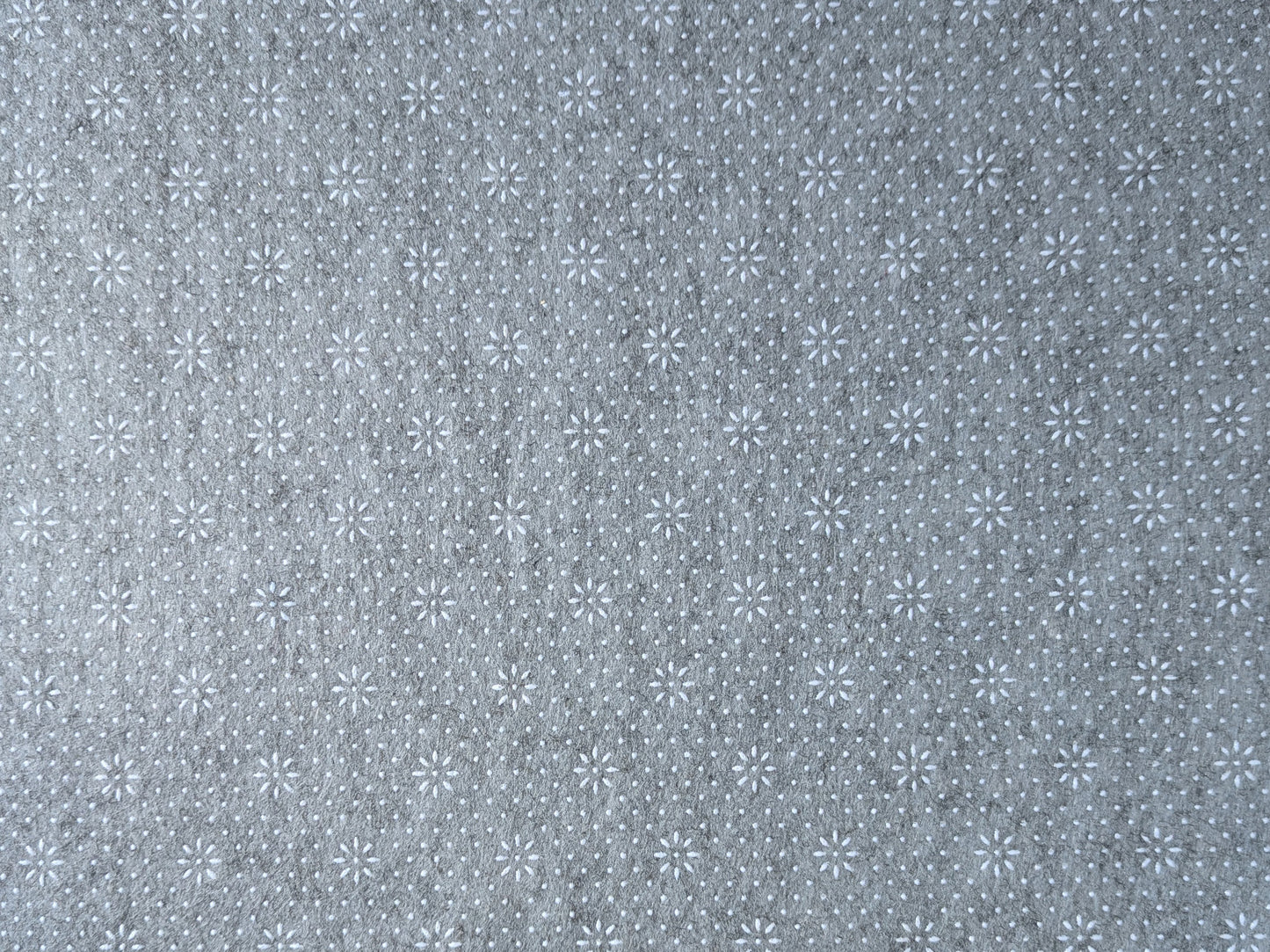 Non-skid gripping-dot backing of the designer cushioned rug pad