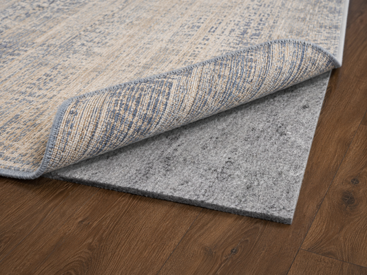 felt + rubber rug pad with rug on hardwood