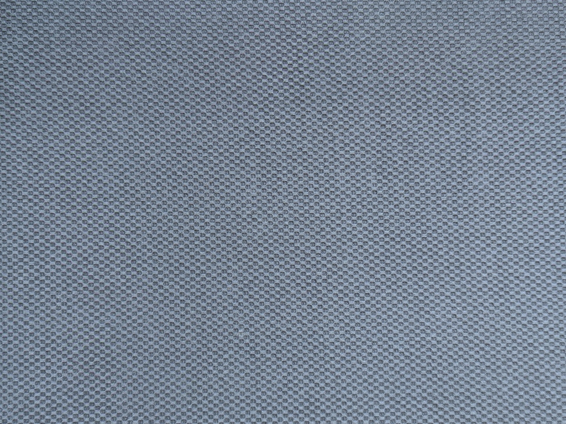 Embossed non-skid rubber backing of the ultra-thin rug pad